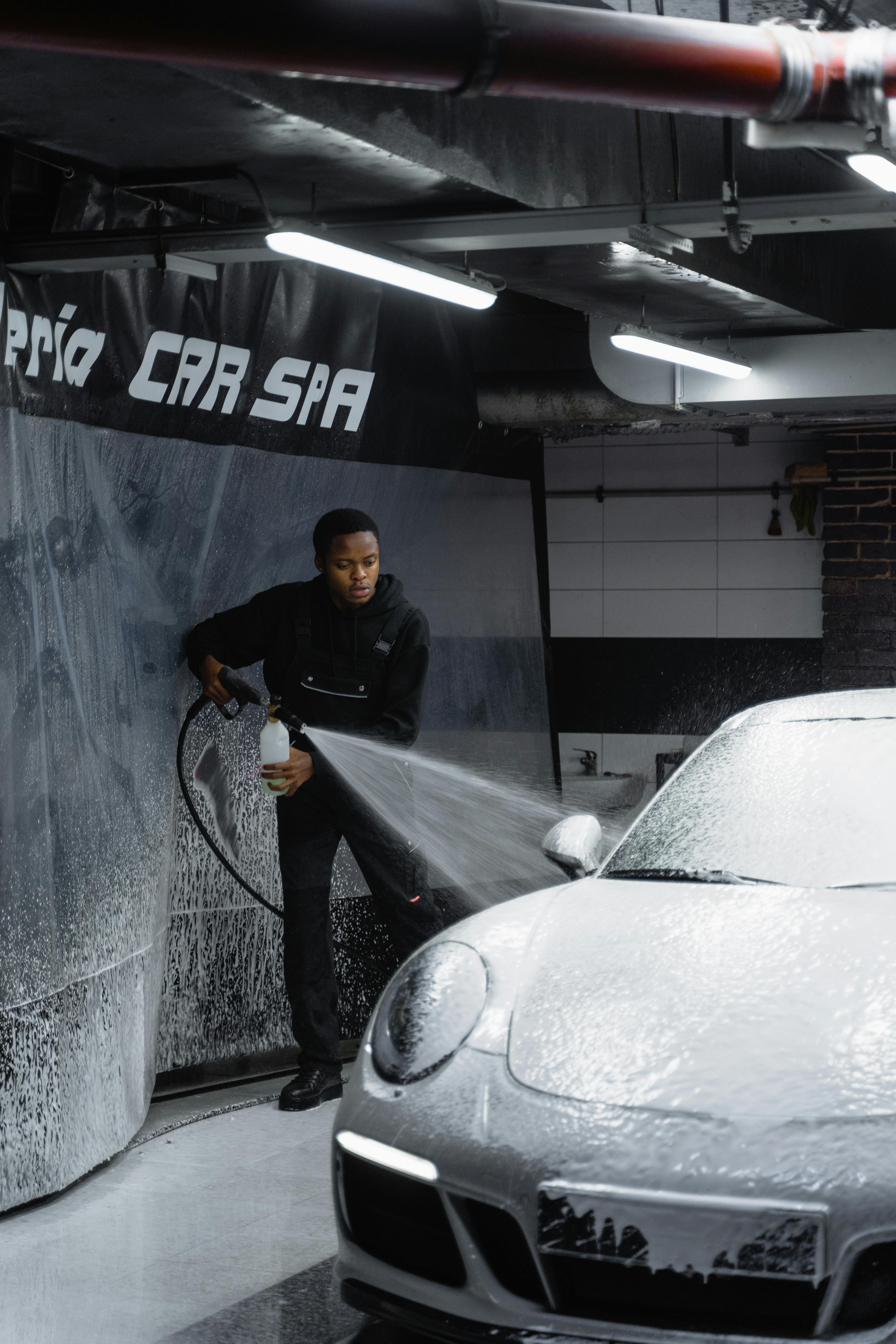 Porsche 911 being foam washed at Pria Car Spa